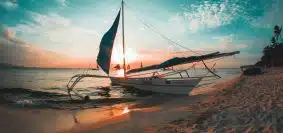 white boat docked on seashore